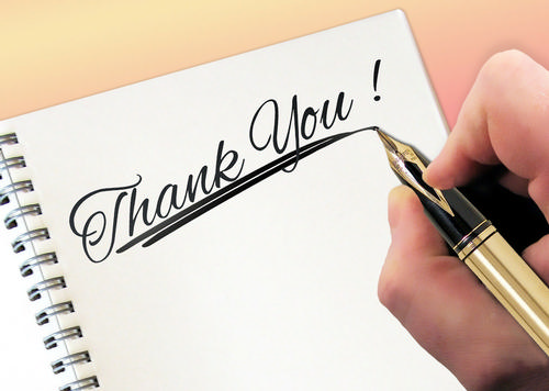 hand, writing ’thank you’